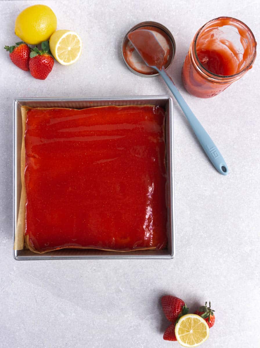 an image of strawberry lemon bars on a countertop