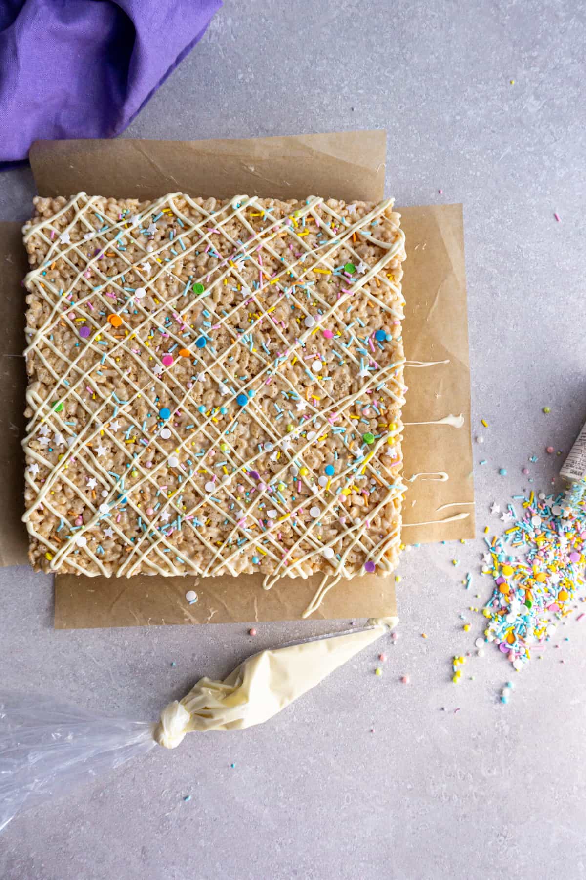 A tray of copycat Disney rice krispie treats sits on the countertop ready to be cut and served.