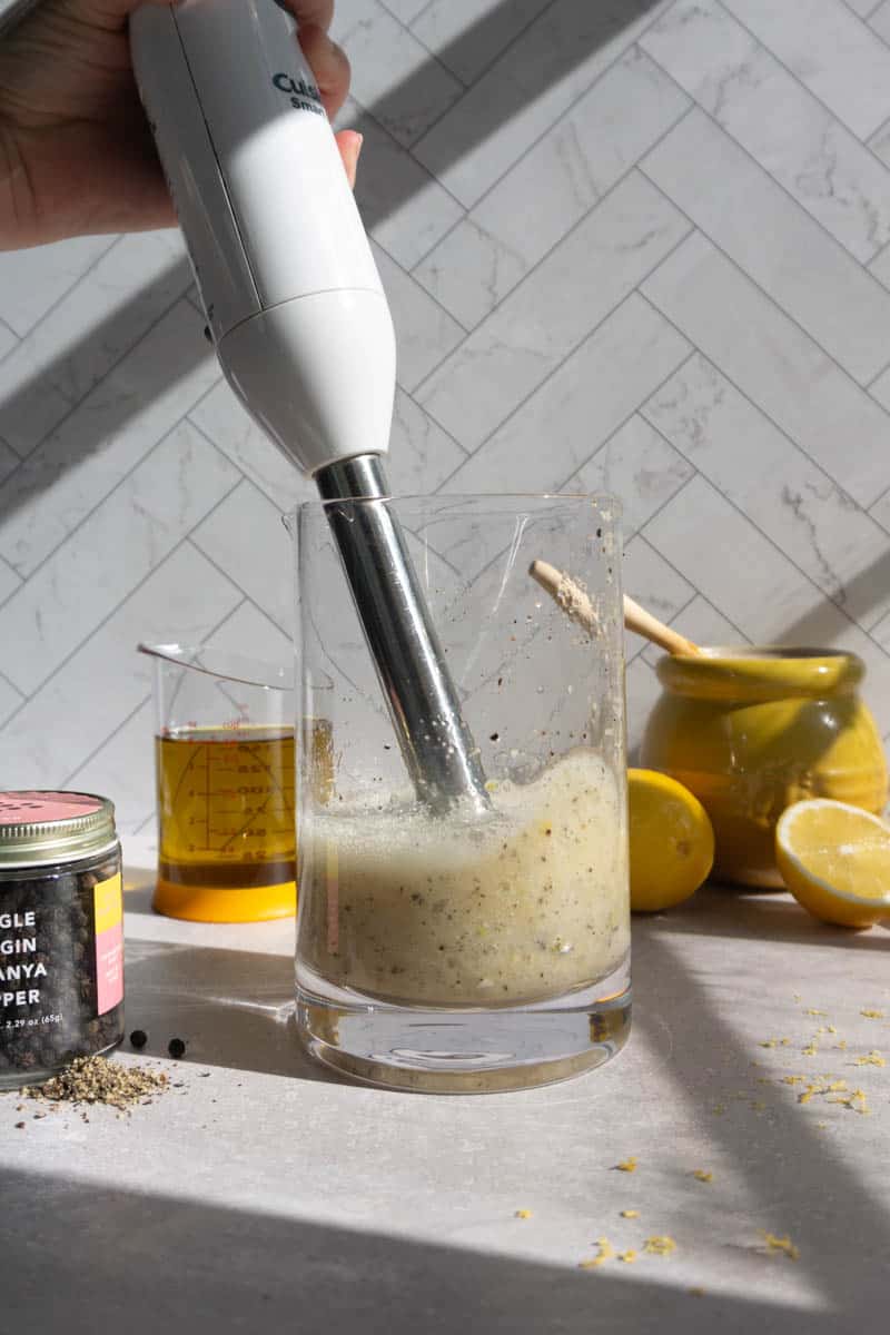 mixing the base ingredients for lemon pepper vinaigrette.