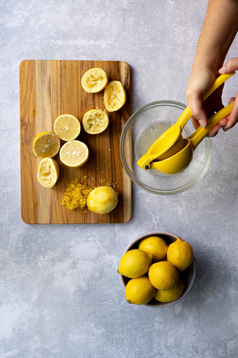 Step 2 in making homemade lemon simple syrup: juicing lemons to get one cup of juice.
