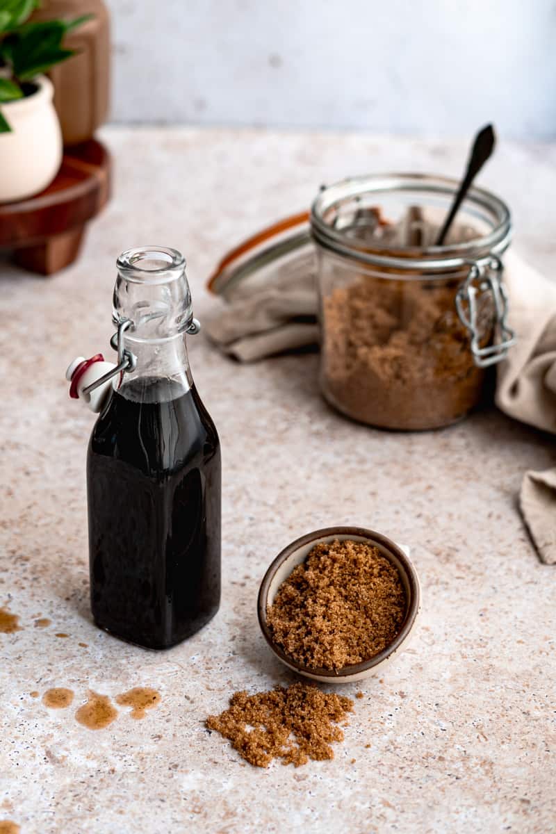 Step 4 of making brown sugar simple syrup: pour your syrup into an airtight bottle for storage.