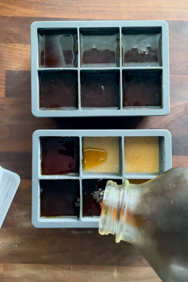 Step 8 of making iced pumpkin spice latte coffee cubes: adding the coffee layer to the cubes.