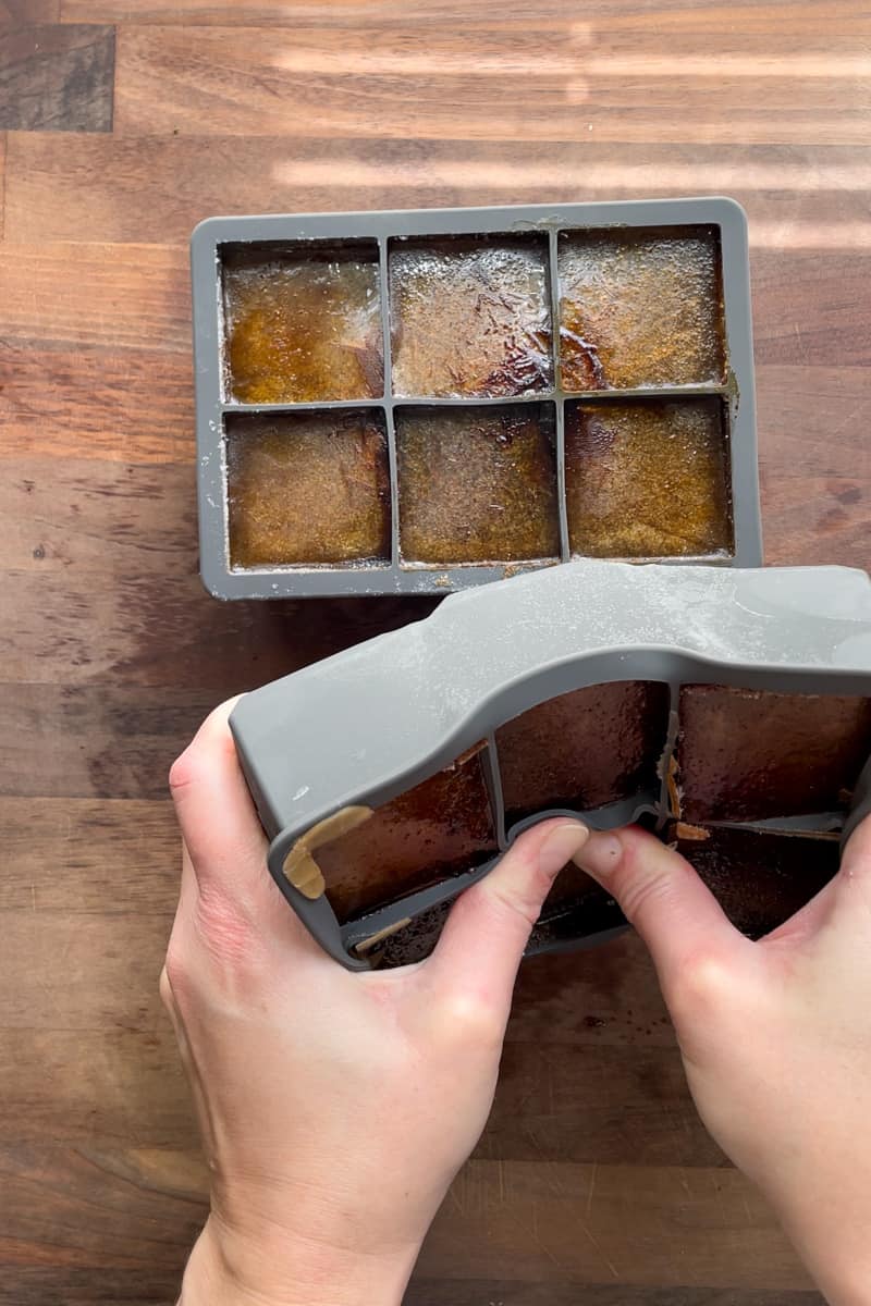Step 9 of making iced pumpkin spice latte coffee cubes: removing the finished cubes from the tray.