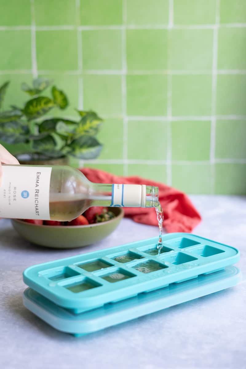 Step 1 of making frozé: Pour rosé in ice cube trays and freeze until mostly solid, at least 6 - 8 hours or overnight.