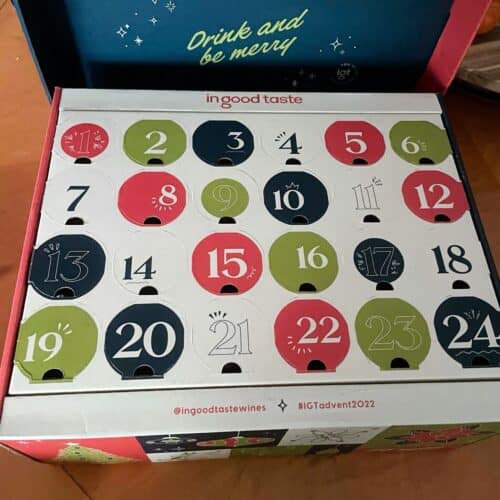 A photograph shows the 2022 In Good Taste wine advent calendar sitting on a dining table.