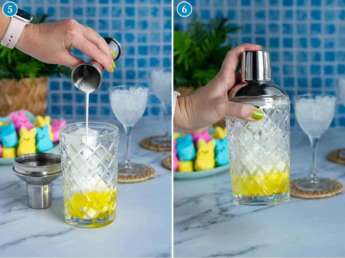 A hand pours cream from a jigger into a glass with yellow and white liquor layers, then places a cocktail shaker lid on the glass—creating a festive peeps martini. Peeps marshmallows and ice-filled glasses are in the background.