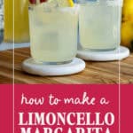 A hand places a lemon slice on a glass filled with a light yellow limoncello margarita and ice, with another similar glass nearby. Text reads: How to make a Limoncello Margarita. Website: arecipeforfun.com.