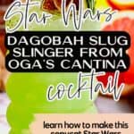 A vibrant green Dagobah Slug Slinger cocktail in a curvy glass, garnished with a dried lime slice and rosemary, with text promoting a Star Wars-themed copycat recipe.