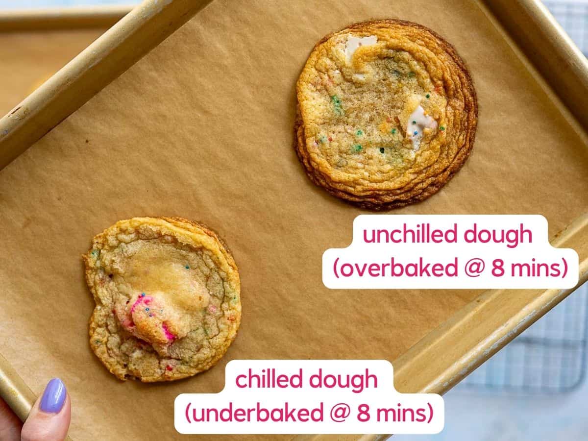 A hand holds a baking tray with two cookies, resembling circus animal cookies. The top is labeled “unchilled dough (overbaked @ 8 mins)” and the bottom “chilled dough (underbaked @ 8 mins).”.